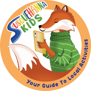 Illustration of fox in a green sweater on a cell phone with the words Susquehanna Kids - Your guide to Local Activities