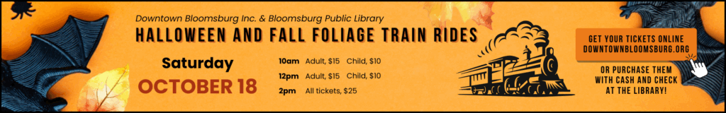 A promotional banner for "Halloween and Fall Foliage Train Rides" on Saturday, October 18, presented by Downtown Bloomsburg Inc. & Bloomsburg Public Library. The orange banner features bat and spider decorations, an illustration of a train, and details on ticket prices for 10 AM, 12 PM, and 2 PM rides, with instructions to purchase tickets online at downtownbloomsburg.org or at the library.