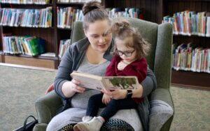 Mother and daughter reading a story.